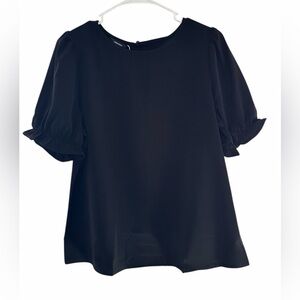 Dokotoo Woman’s Elegant Black Women's Top
Size Medium PTP 20.5” NWT